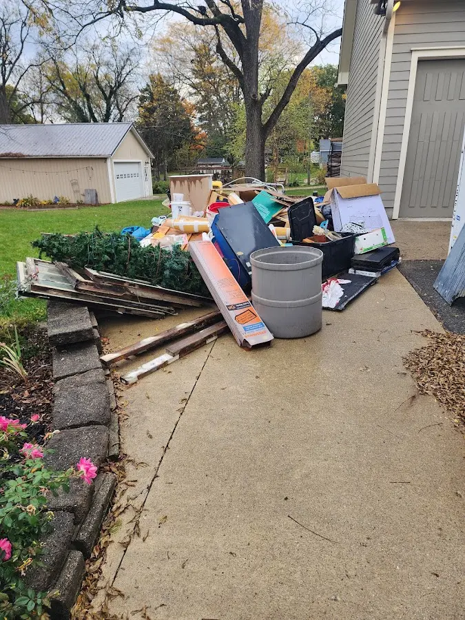 Dumpster being loaded with debris for 3 Yard Dumpster Rental in Jeffersontown